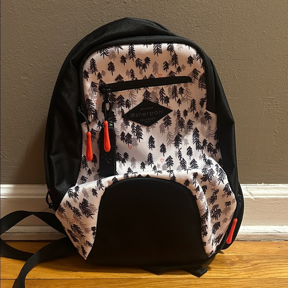 Sherpani Black and White Backpack with Red Zippers